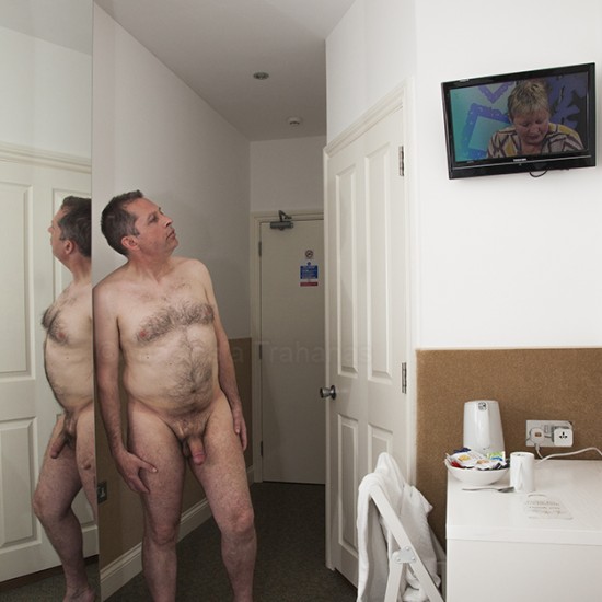 Naked man in hotel room