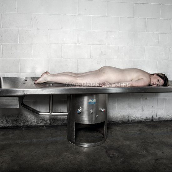 Naked woman on mortuary table